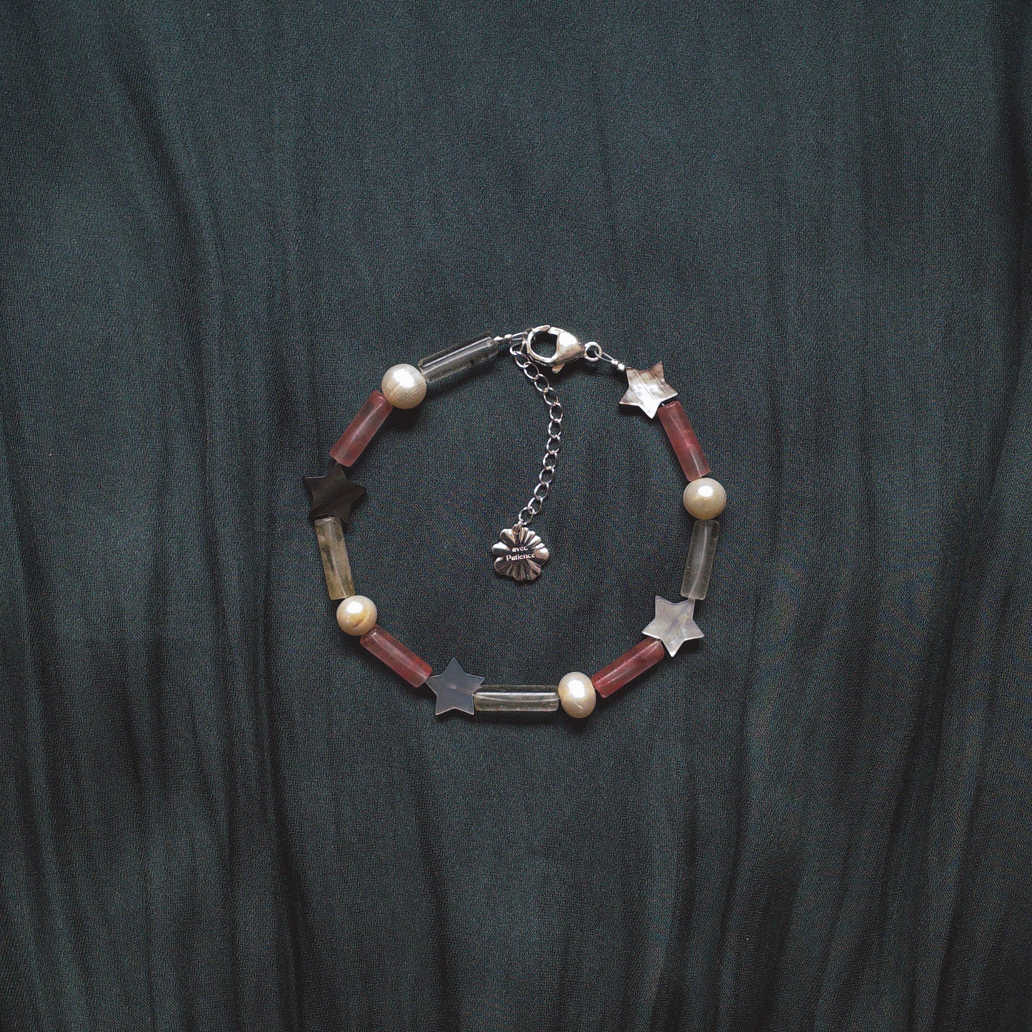 Bracelet with pearly stars and cherry quartz tube beads Bracelet with pearly stars and cherry quartz tube beads