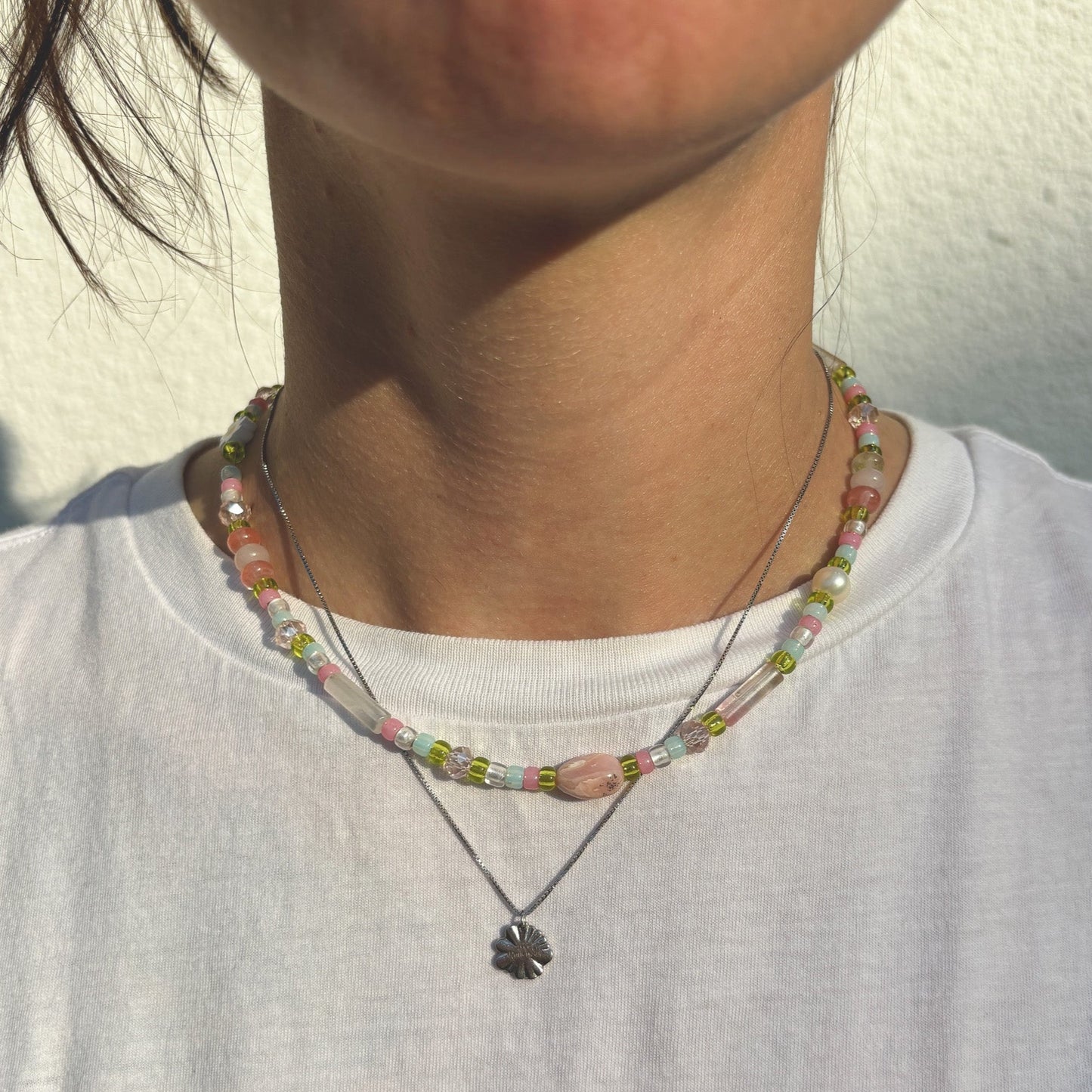 Semi-precious pearl necklace with pink accent and white flowers